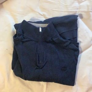7 men’s Lacoste sweaters.